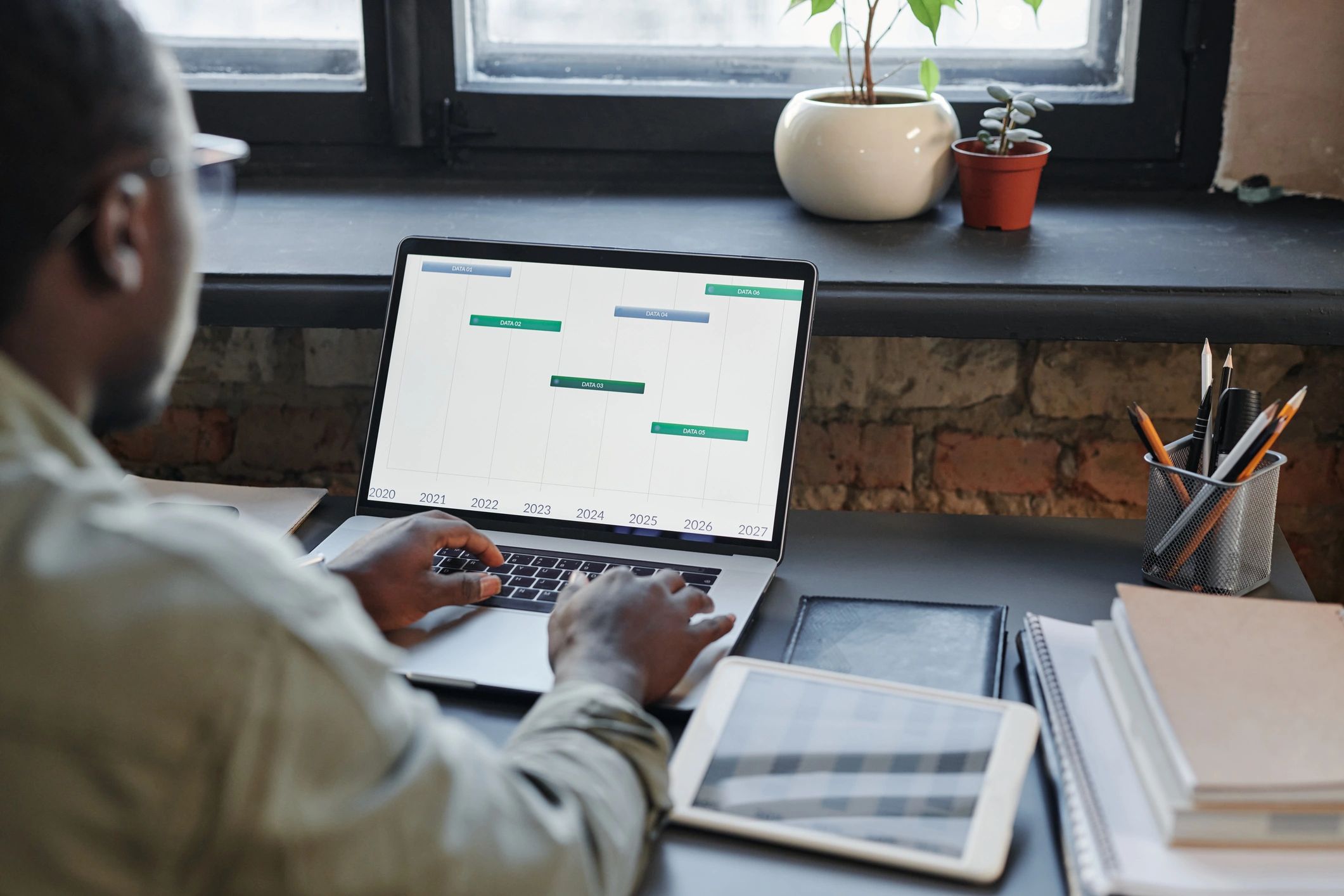 Professional working on a laptop in an office